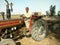 A tractor driver driving his tractor