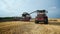 Tractor drives toward to camera on wheat field