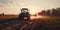 Tractor driving across large field making special beds for sowing seeds into purified soil.