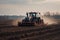 Tractor driving across large field making special beds for sowing seeds into purified soil. Agricultural vehicle works in the