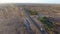 A tractor driving on a remote Indian desert road