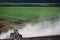 Tractor on a dusty dry field