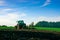 Tractor farm. Agriculture farm machinery on landscape land field. Farmer machine equipment for crop. Tractor farm fields