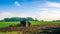 Tractor farm. Agriculture farm machinery on landscape land field. Farmer machine equipment for crop. Tractor farm fields