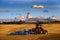 Tractor Farming Ground Harvesting Crops in Fall Autumn Teton Mountains Rugged