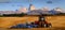Tractor Farming Ground Harvesting Crops in Fall Autumn Teton Mountains Rugged with Moon