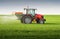 Tractor fertilizing in field