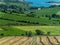 Tractor in the field on a spring day. Picturesque agrarian landscape of Ireland. harvesting hay for animal feed. Farm. Green grass