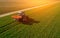 Tractor on a green field. aerial survey of agriculture