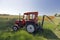 A tractor in a green meadow in the cultural landscape of Weinviertel, Lower Austria