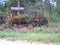 Tractor grown over abandon lost bulldozer nature rusty