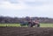 The tractor handles the land. Farmers prepare the land for sowing seeds