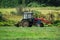 The tractor on the hay in Russia.