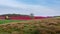 Tractor irrigating flower field in springtime