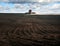 Tractor, land preparation with seed cultivator in farmland. The tractor plows the field. Agricultural works for processing,