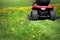 Tractor lawn mower cutting the grass in springtime