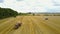 Tractor Loading Bales Of Hay