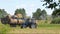 Tractor loading hay