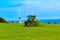 Tractor mowing grass at the Leas Folkestone UK