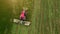 A tractor mows a field of aerial photography with drone