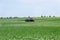 Tractor nozzles fertilizing crops field