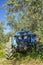 Tractor performing tillage tasks in the olive grove - disc harrows