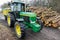 Tractor and pile of wood