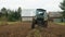 tractor ploughs arable land, an agricultural concept