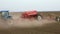 Tractor ploughs tills plows and seeds on the field