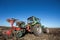 Tractor with plowing equipment in the field