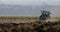 Tractor Plowing a Field.Telephoto lens