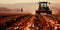 tractor plowing through fields, preparing the soil for spring planting, showcasing the mechanized side of modern