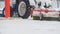 Tractor plowing snow on street, close up