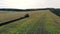 Tractor plowing soil. Top view.