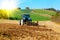 Tractor plows a field