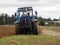 Tractor plows field. Tractor rides on the field and plows arable land.  Details and close-up.