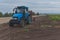 Tractor in a potato field
