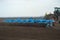 tractor preparing land with seedbed cultivator at spring farm field