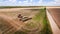 Tractor preparing land for sowing sixteen rows aerial, concept of cultivation, sowing, plowing field, tractor and production autom