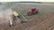 Tractor preparing land for sowing sixteen rows aerial, concept of cultivation, sowing, plowing field, tractor and production autom