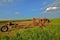 Tractor and Rake Parked in Hay Field