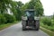 Tractor, rear view, on a lonely country road