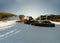 Tractor, Red Group of Snow-grooming machine on snow hill ready for skiing slope preparations, Bansko, Bulgaria