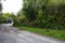 Tractor riding on road