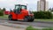 Tractor with rubber asphalt compaction wheels