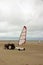 Tractor and sand yacht. Beach of Normandy