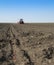 Tractor seeding crops at field