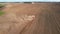 Tractor on Seeds sowing in farmers country. Agricultural tractor sowing seed onto at field. Farming and seeding concept. Planting