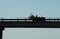 Tractor silhouette on bridge