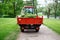 Tractor with a small body, where folded grass which mowed on lawns using trimmers and lawn mowers. the territory of Gatchina Park